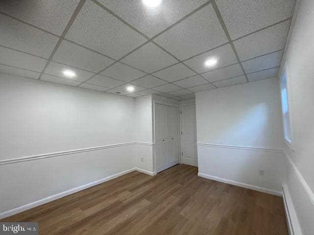 3433 Gregg Rd, Brookeville, MD 20833 - spare room with wood finished floors, baseboard heating, baseboards, a paneled ceiling, and recessed lighting