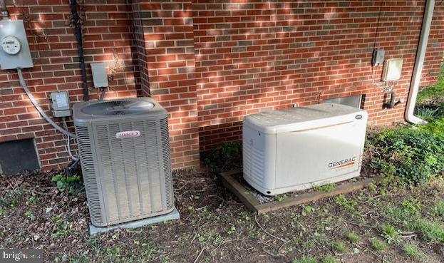 3433 Gregg Rd, Brookeville, MD 20833 - exterior view of central AC, a power unit, electric meter, and brick siding
