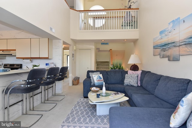 108 120th St Unit 5462, Ocean City, MD 21842 - living room featuring a towering ceiling, stairway, and visible vents