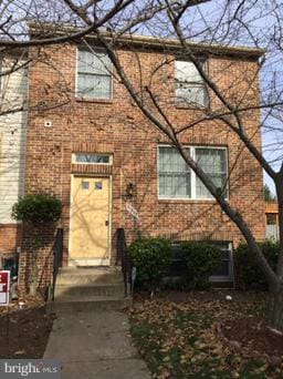 view of front of home with brick siding