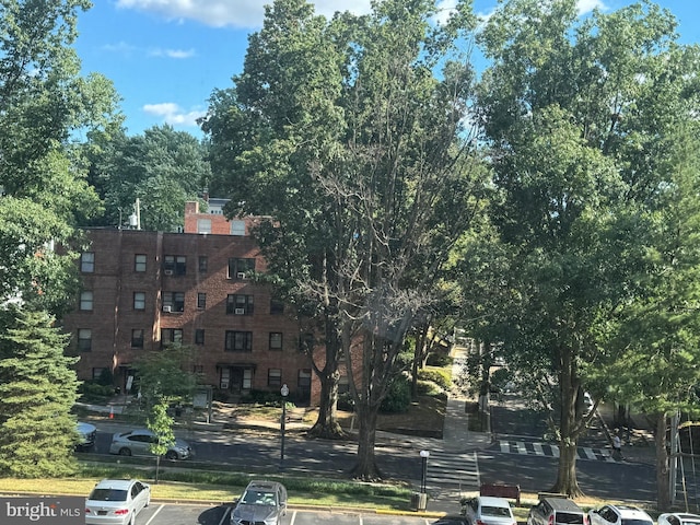 view of property featuring uncovered parking