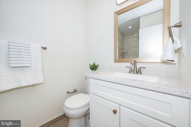 full bath featuring toilet and vanity