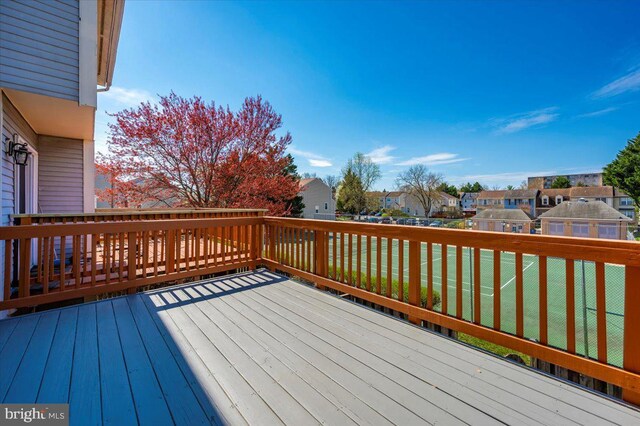 wooden terrace with a residential view