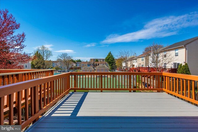 wooden terrace with a residential view
