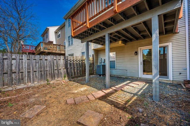 view of yard with fence and a wooden deck