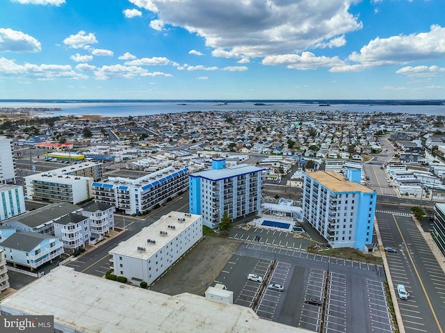 drone / aerial view featuring a water view and a city view