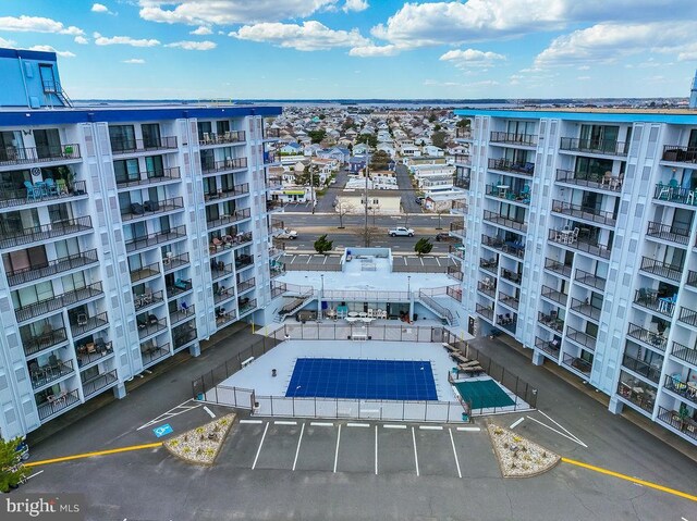 view of property featuring uncovered parking