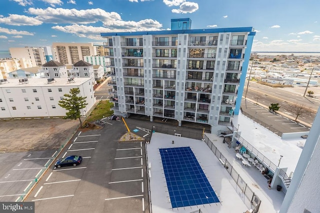 exterior space with uncovered parking and a view of city