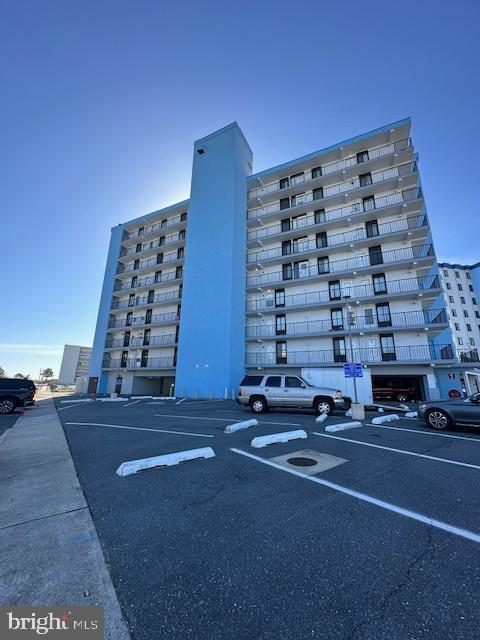 view of property with uncovered parking