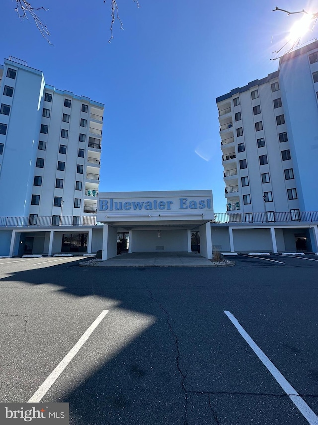 view of property with uncovered parking