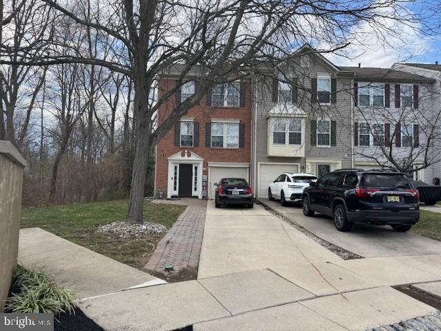 view of front of house featuring driveway and a garage