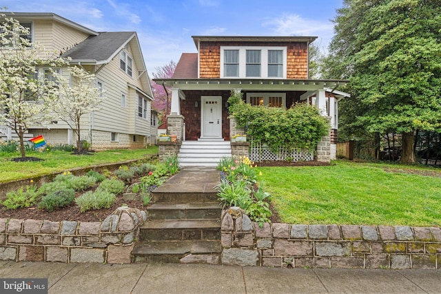view of front of house with a front lawn and a porch