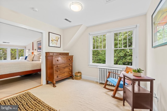bedroom featuring visible vents, baseboards, radiator, and carpet floors