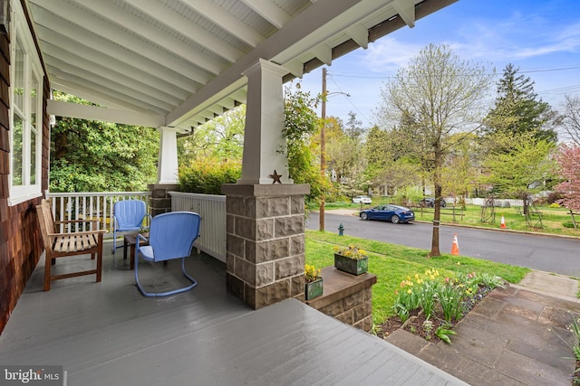 view of patio featuring a porch