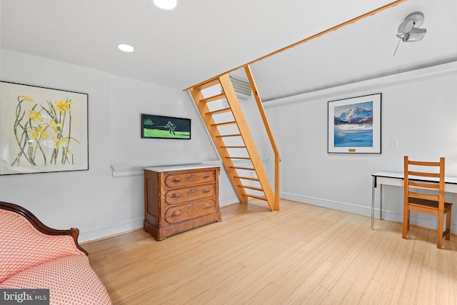 sitting room with light wood finished floors, baseboards, and recessed lighting