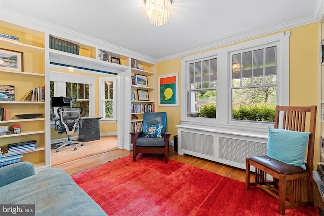 office with ornamental molding, radiator, and wood finished floors
