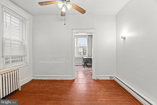 4935 Old York Rd, Philadelphia, PA 19141 - empty room with a baseboard radiator, baseboards, radiator, and wood finished floors
