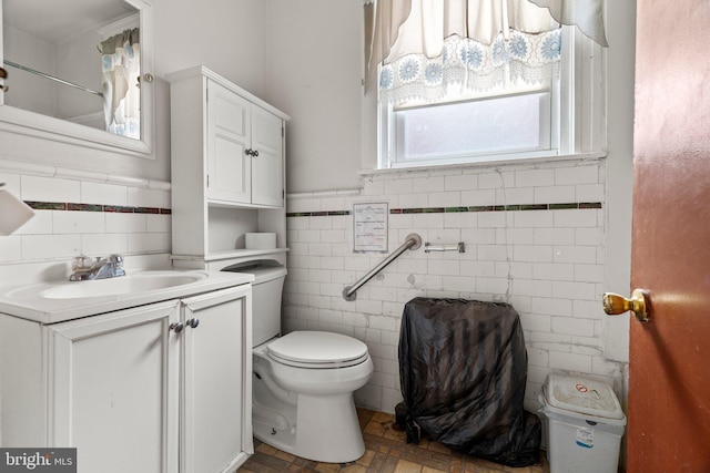 4935 Old York Rd, Philadelphia, PA 19141 - bathroom with vanity, tile walls, toilet, and wainscoting