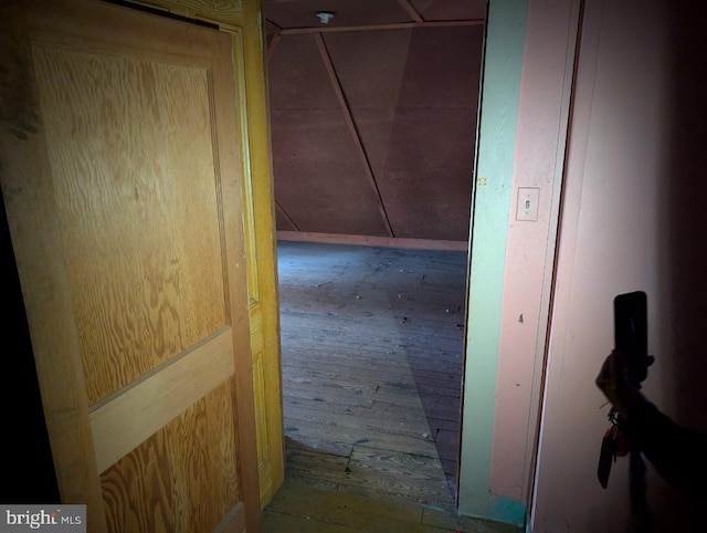 hall with wood-type flooring