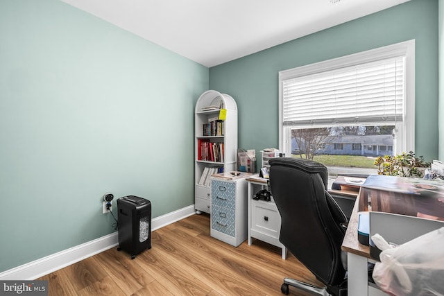office featuring light wood finished floors and baseboards