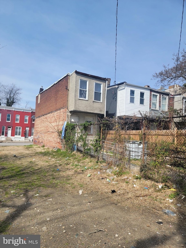 2419 Brentwood Ave, Baltimore, MD 21218 - exterior space featuring stucco siding and fence