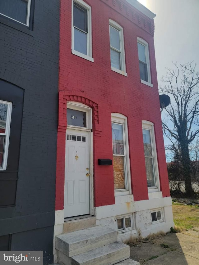 2419 Brentwood Ave, Baltimore, MD 21218 - view of front of house with brick siding and entry steps