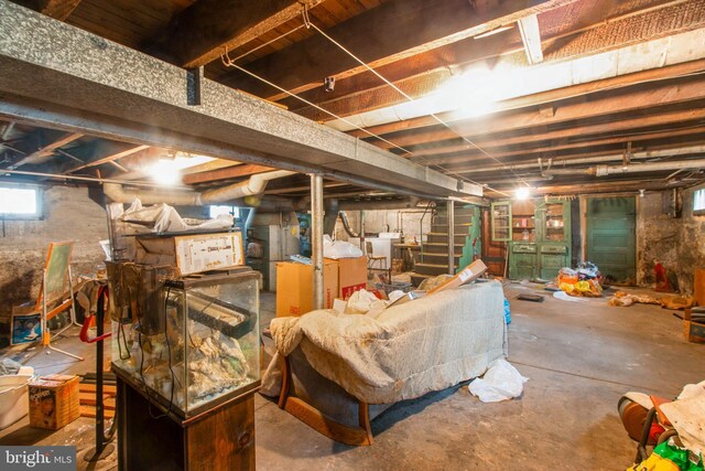 basement featuring stairs