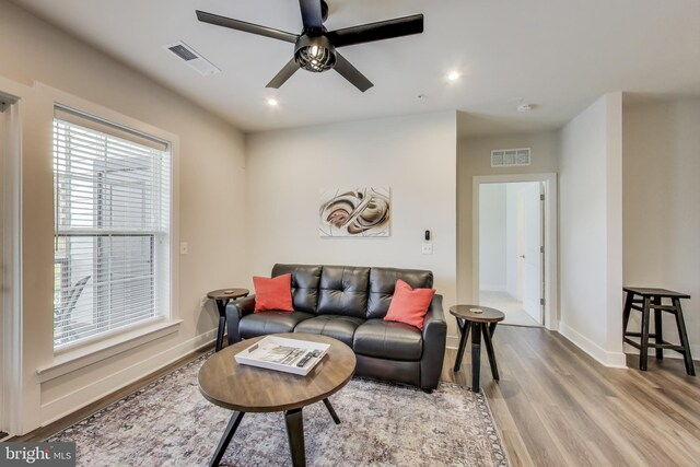 102 Saint Ives Unit 403, National Harbor, MD 20745 - living area with baseboards, visible vents, wood finished floors, and a ceiling fan