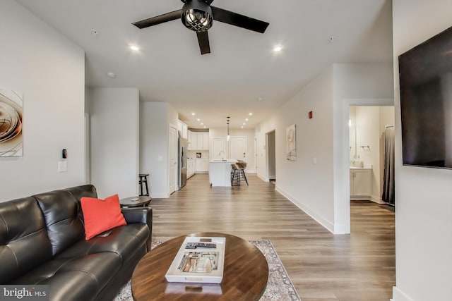 102 Saint Ives Unit 403, National Harbor, MD 20745 - living room with a ceiling fan, baseboards, light wood-style flooring, and recessed lighting
