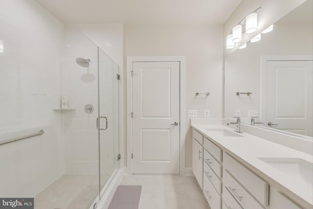 102 Saint Ives Unit 403, National Harbor, MD 20745 - full bathroom with double vanity, a sink, a stall shower, and tile patterned floors