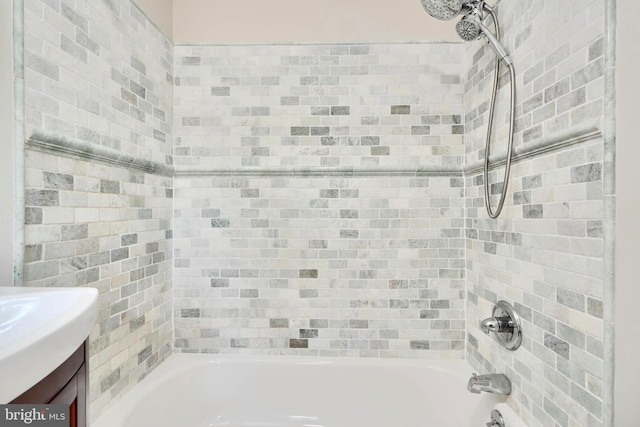 bathroom with tub / shower combination and vanity