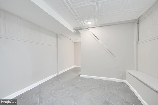 walk in closet with light tile patterned flooring
