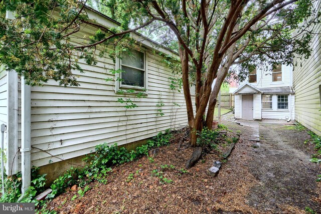 view of side of home with fence
