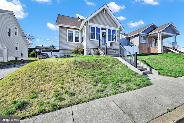 view of front of property with a residential view and a front lawn