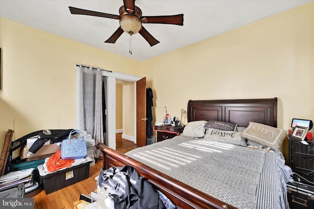 bedroom featuring ceiling fan and wood finished floors