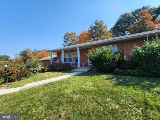 12114 Vale Smt, Frostburg, MD 21532 - view of front of house with brick siding, covered porch, and a front lawn