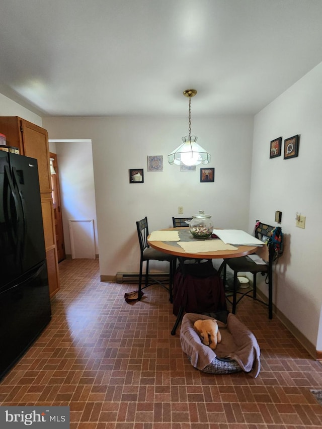 12114 Vale Smt, Frostburg, MD 21532 - dining room featuring brick floor and baseboards