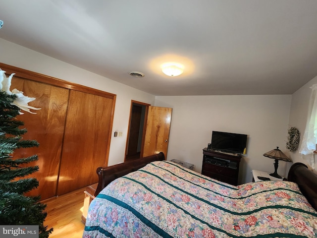 12114 Vale Smt, Frostburg, MD 21532 - bedroom featuring visible vents, light wood-style floors, and a closet