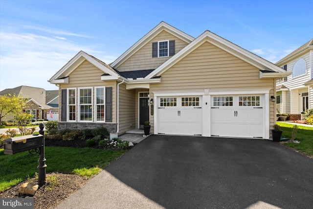 craftsman-style house featuring a garage and driveway