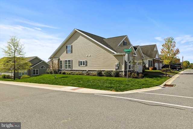 view of property exterior featuring a yard