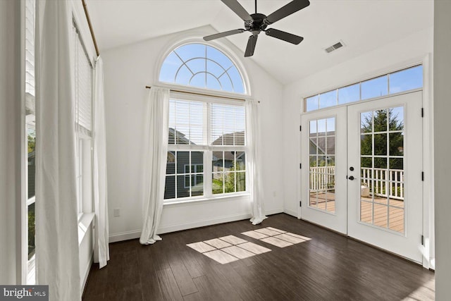 doorway with french doors, dark wood-type flooring, lofted ceiling, and visible vents