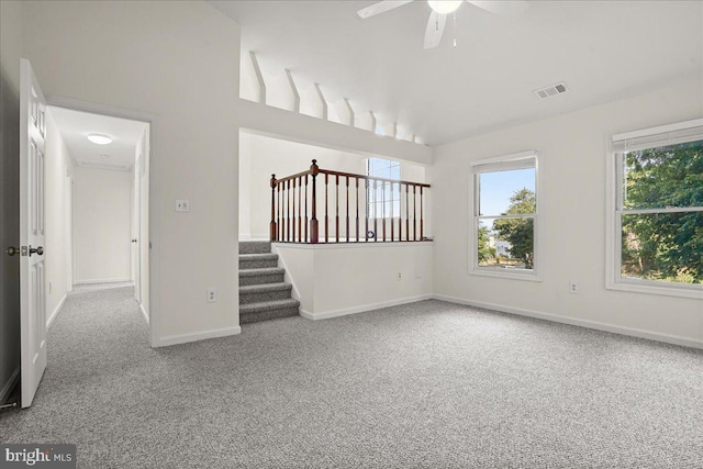 17 Alexandria Overlook Dr, Oxon Hill, MD 20745 - carpeted empty room with stairway, baseboards, visible vents, lofted ceiling, and ceiling fan