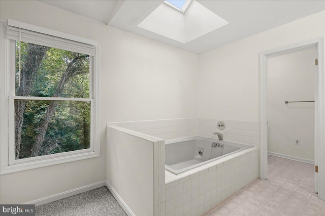 17 Alexandria Overlook Dr, Oxon Hill, MD 20745 - full bathroom featuring baseboards, a tub with jets, and a skylight