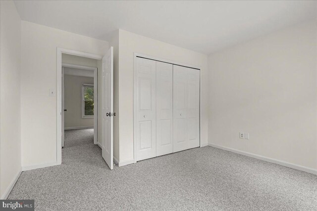 17 Alexandria Overlook Dr, Oxon Hill, MD 20745 - unfurnished bedroom with carpet flooring, baseboards, and a closet