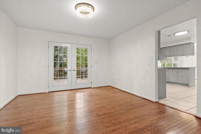 17 Alexandria Overlook Dr, Oxon Hill, MD 20745 - unfurnished room featuring french doors, baseboards, and light wood finished floors