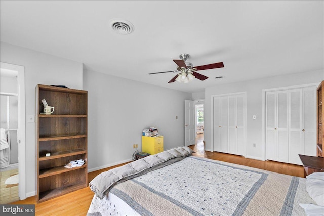 331 Ridge Ave, Winchester, VA 22601 - bedroom with two closets, light wood-style flooring, and ceiling fan