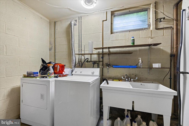 331 Ridge Ave, Winchester, VA 22601 - washroom featuring washing machine and clothes dryer and concrete block wall
