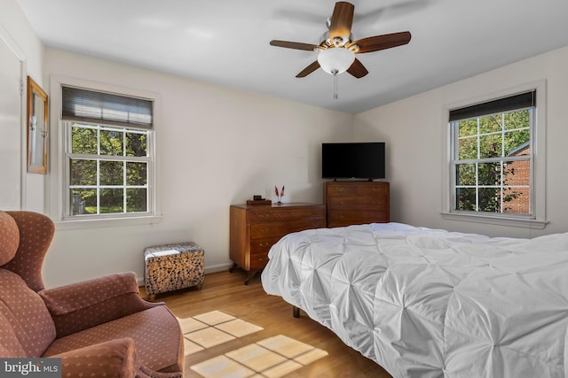 bedroom featuring a ceiling fan and light wood-style floors
