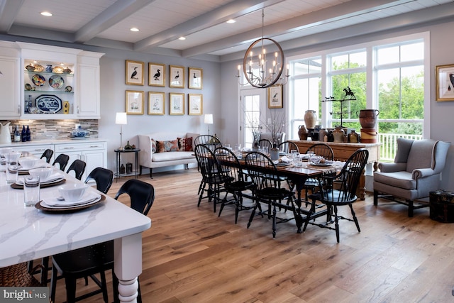 dining room featuring beamed ceiling, recessed lighting, light wood-style floors, and a chandelier