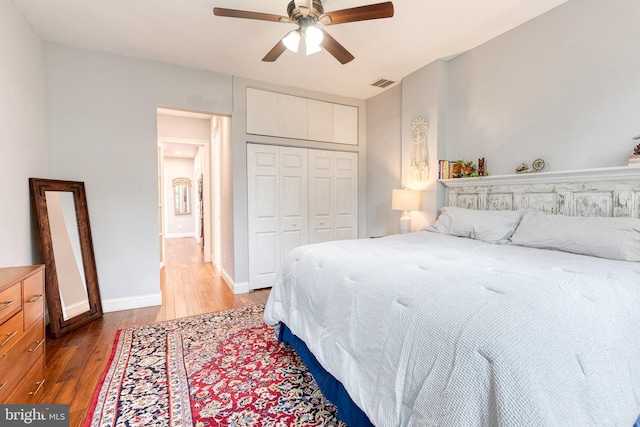 21 N Collington Ave N, Baltimore, MD 21231 - bedroom featuring light wood-type flooring, a closet, baseboards, and a ceiling fan